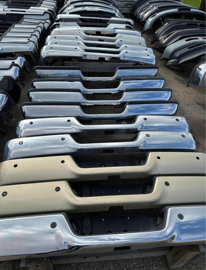 Rows of chrome and dark pickup bumpers organized by shape