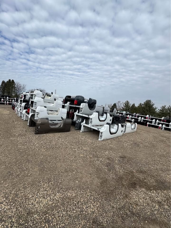Rows of white, silver and black OEM pickup truck beds at the American Truck Beds lot in Wichita, Kansas